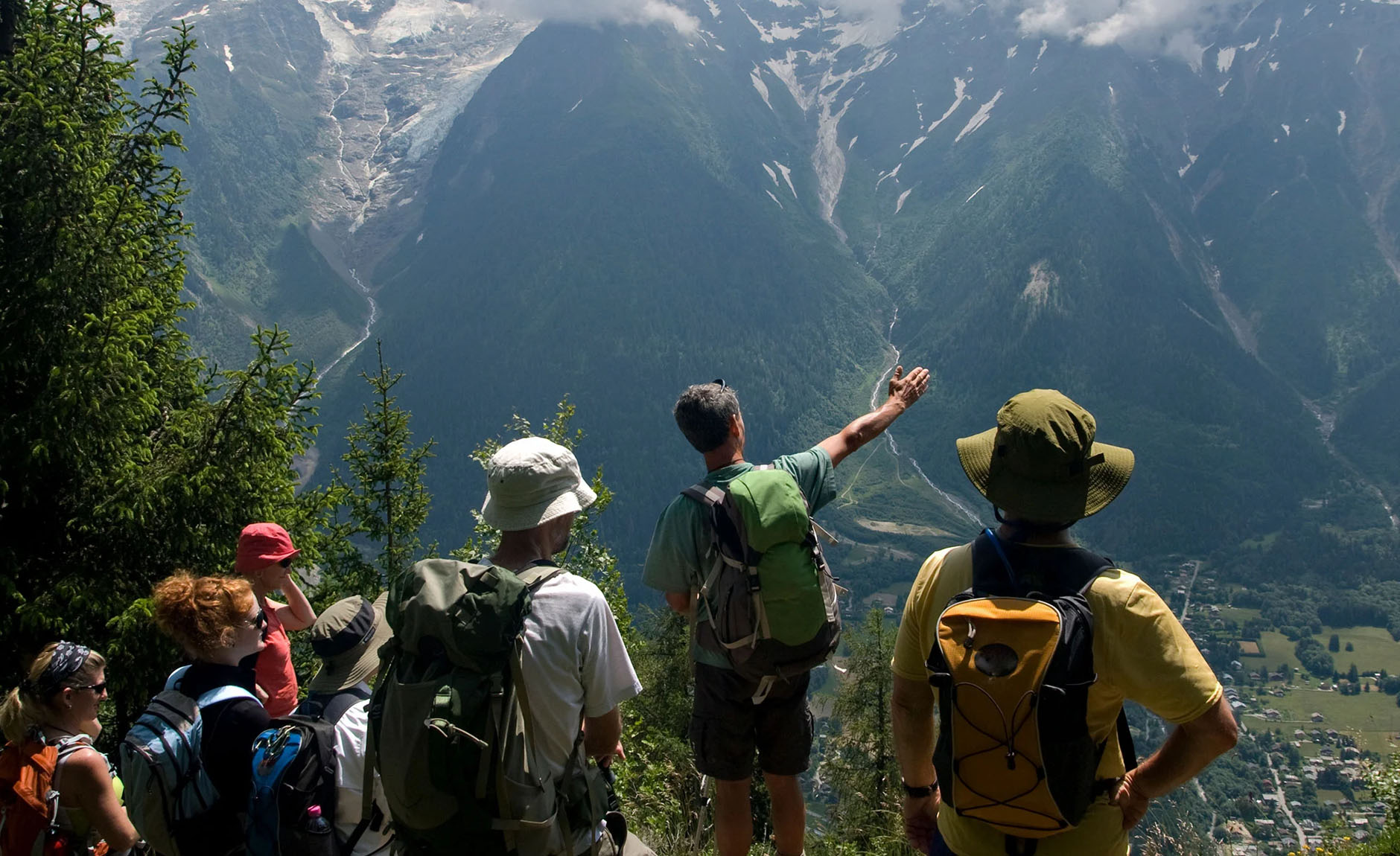 A guided group of hikers taking in the mountain landscape